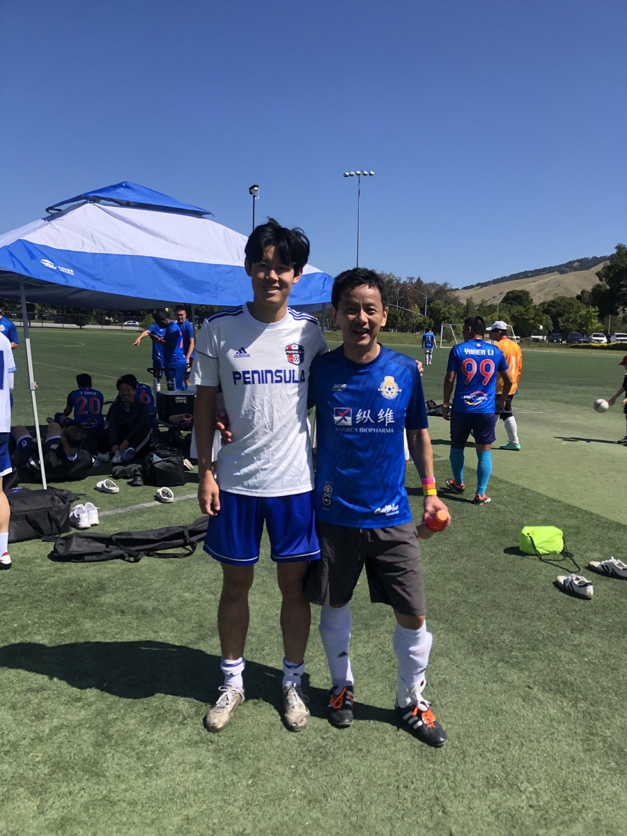 Two footballers posing together after the match